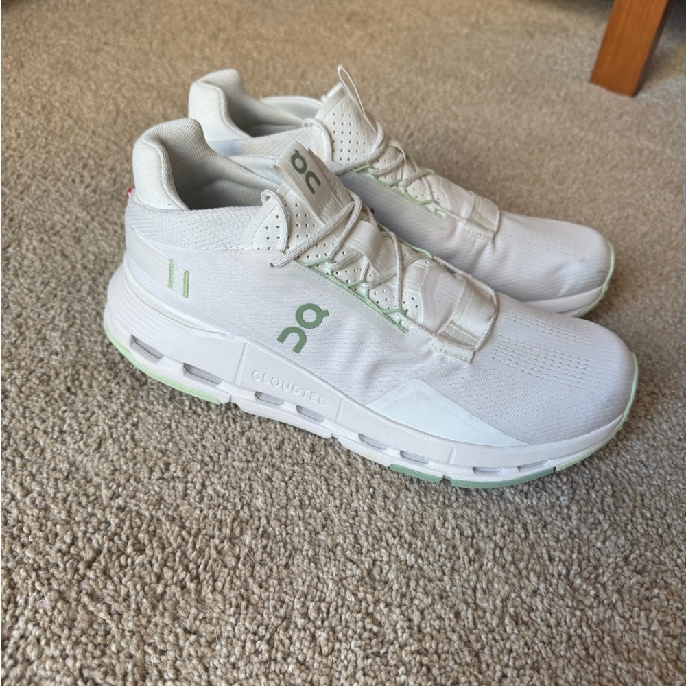 On Running White and Green Athletic Shoes